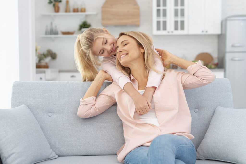 adorable-daughter-embracing-her-mother